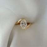 bespoke oval diamond engagement ring in 18ct yellow gold, handcrafted by Casoni Fine Jewellery in Sydney.