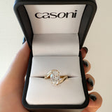 18ct Yellow Gold ring in a Casoni box held by a hand