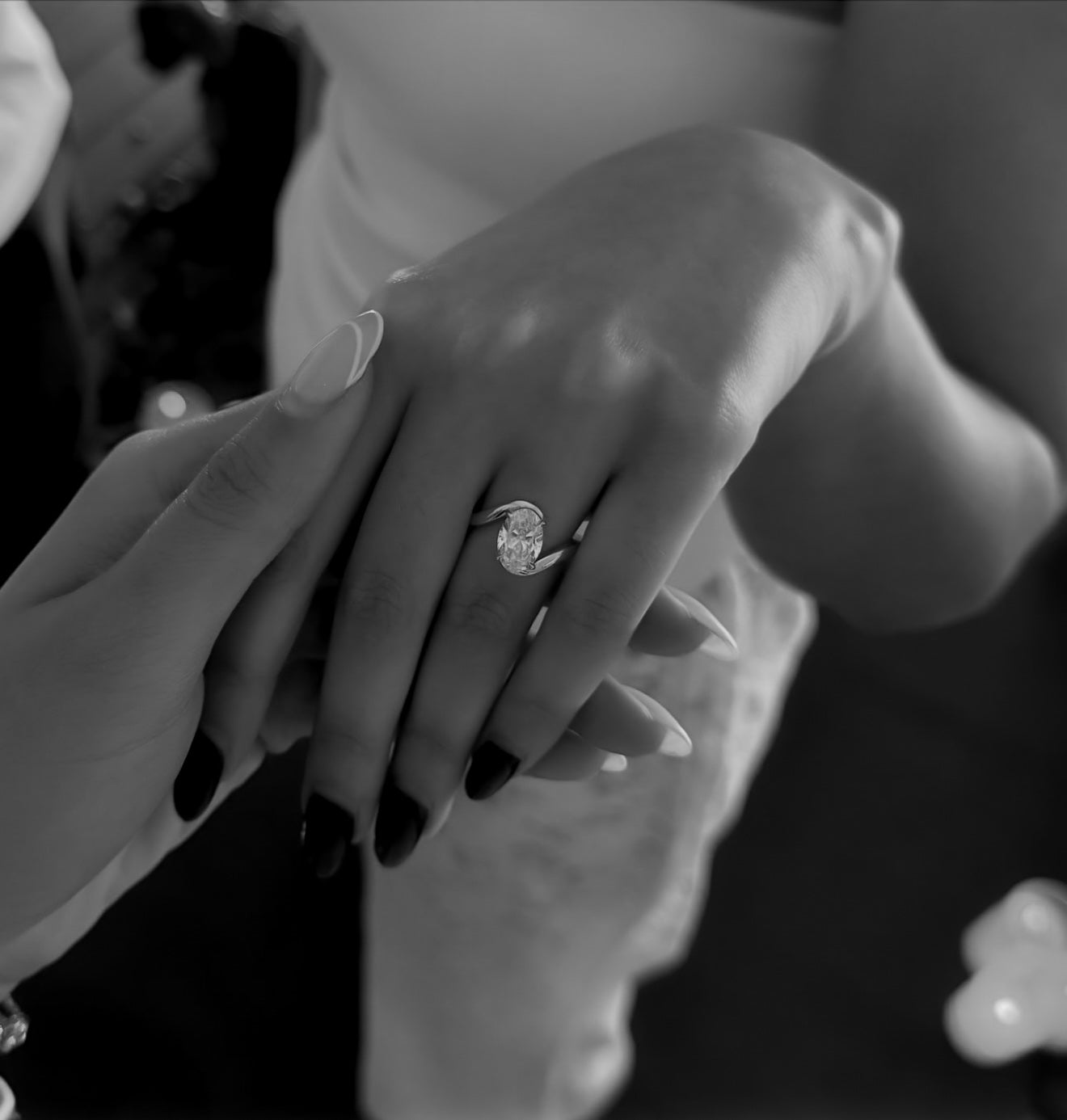 Close-up of a bespoke bypass ring featuring oval diamond set in 18ct yellow gold by Casoni Fine Jewellery, Sydney.